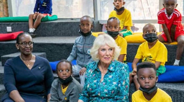 Bright School children seated with Rwanda's First Lady, Jeannette Kagame, and Camilla at the Kigali Public Library, June 2022