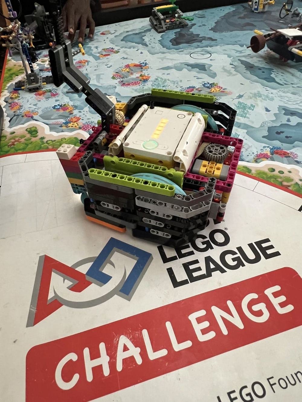 A robot on a FIRST LEGO League Challenge competition mat
