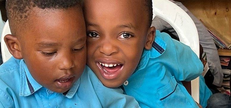 Two TEACH Rwanda learners together in class