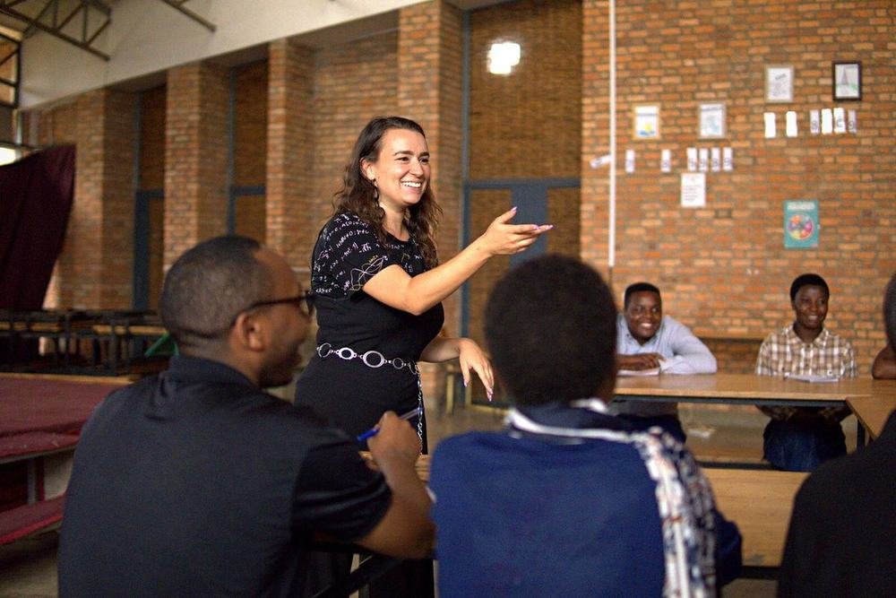 A T4T mentor leading a discussion with Rwandan teachers during a workshop