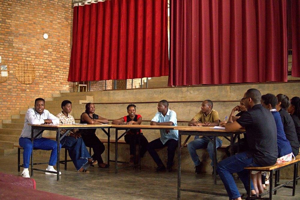 Teachers seated at tables during a T4T workshop