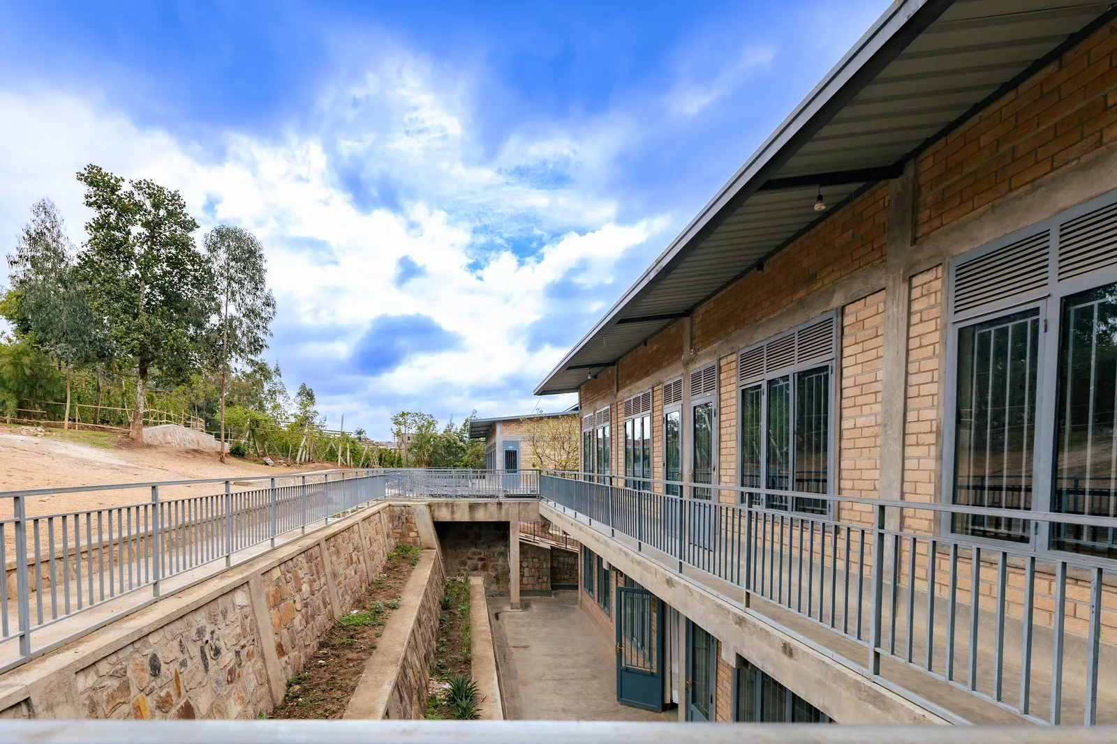 The finished classroom block under a blue sky
